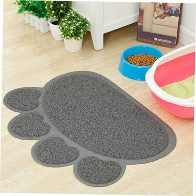 tapis litière chat posé devant le bac pour récupérer les grains