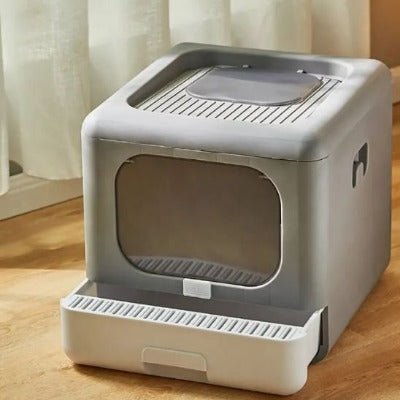 bac a litière pour chat gris avec un tiroir ouvert