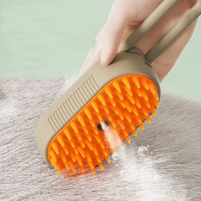 Démonstration d’une brosse chat à vapeur orange